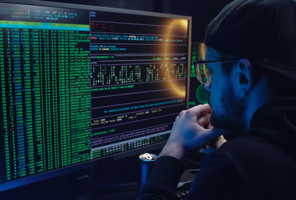 SOC analyst monitoring cybersecurity threats on multiple screens in a modern Security Operations Center
